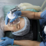 nurse-putting-oxygen-mask-patient