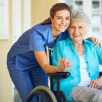 Portrait of nurse, hugging or old woman in wheelchair in hospital helping a senior patient for support. Holding hands, happy smile or healthcare caregiver smiling with an elderly lady with disability.